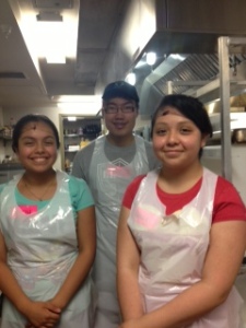 Corey and two of his fellow volunteers in the kitchen.